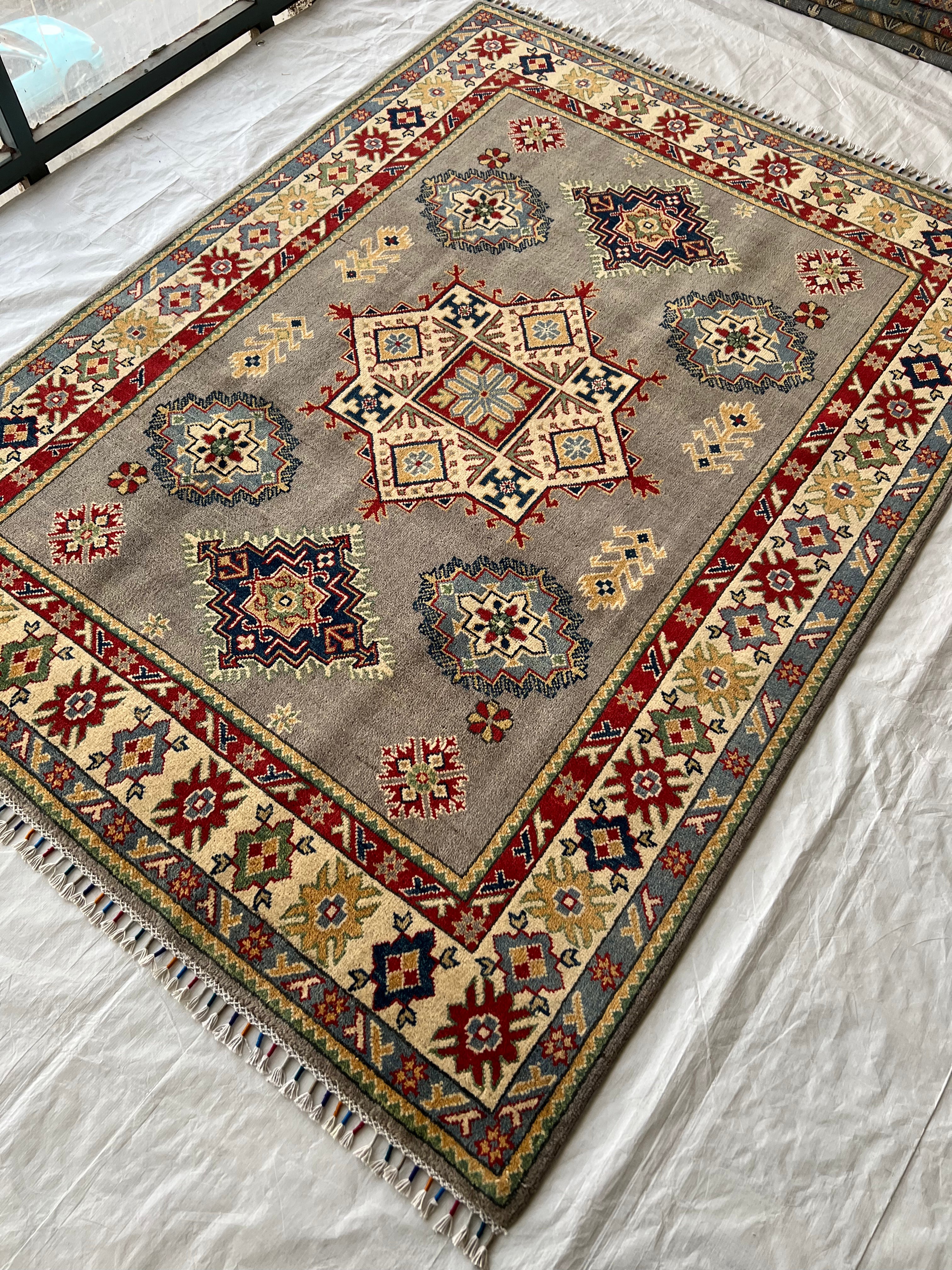 Afghani Rug 5x8 size range tribal Cream laid flat