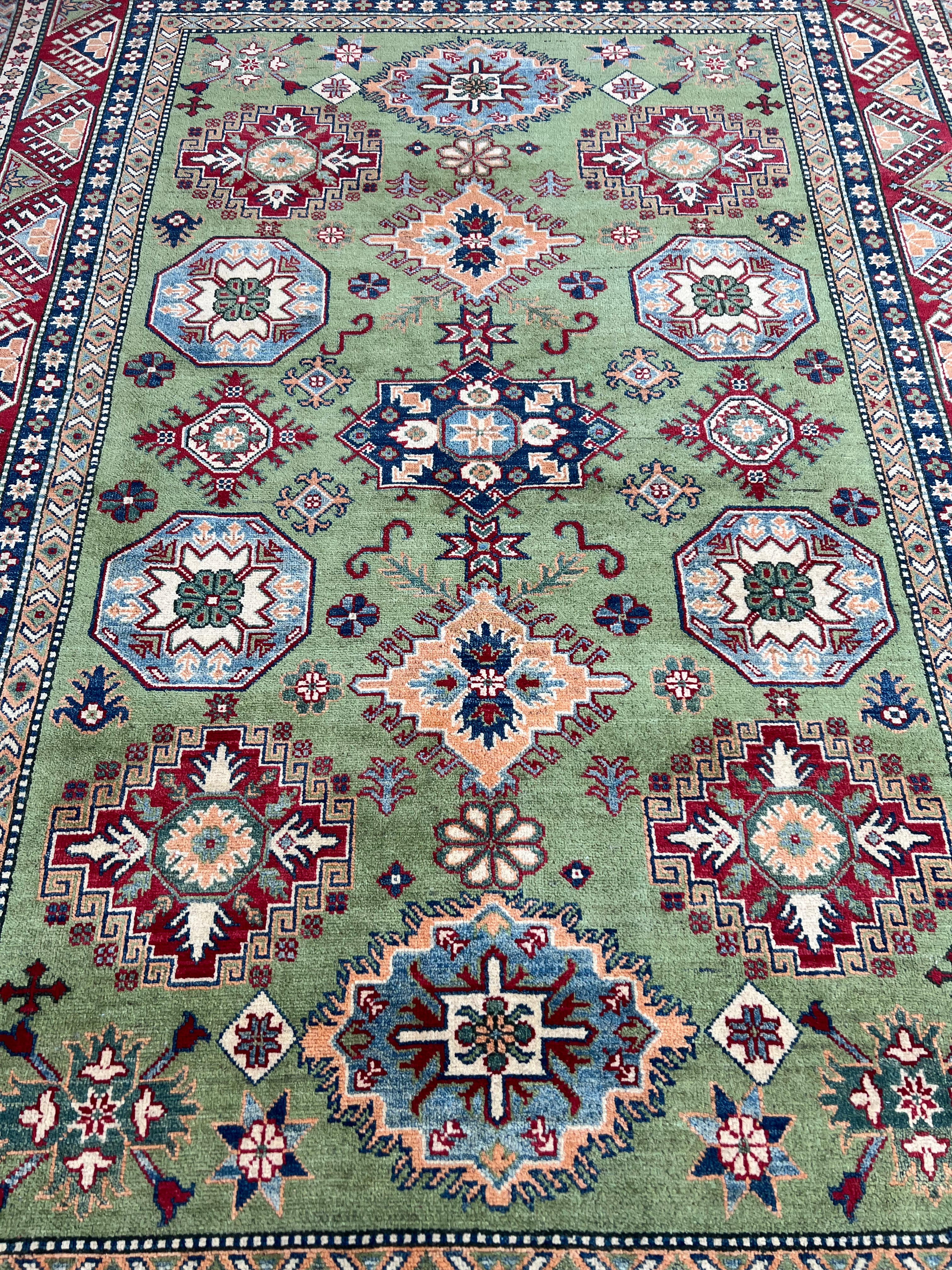 Afghani Rug 7x10 size range tribal Red Green laid flat