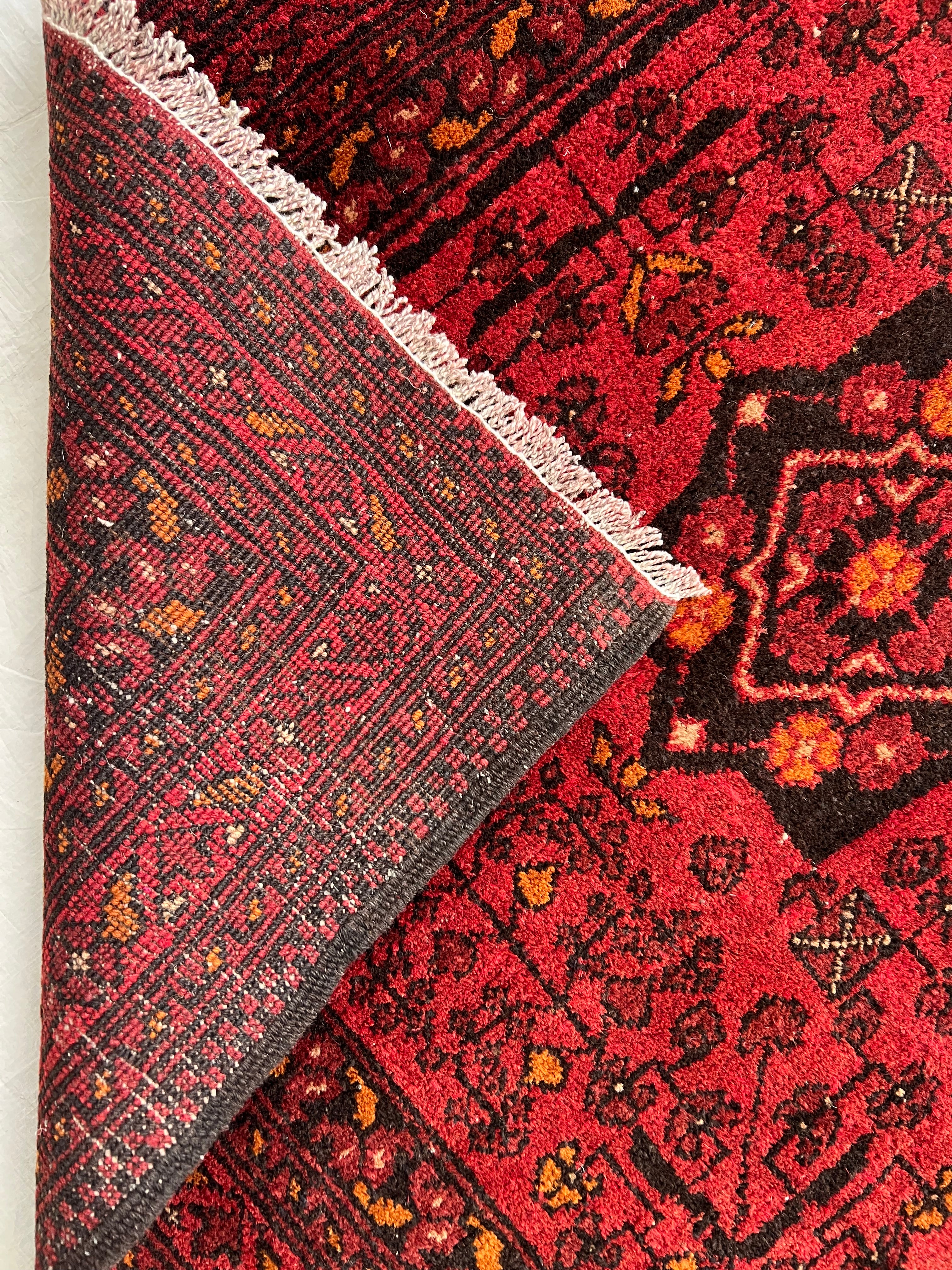 Afghani Rug 4x10 size range bukhara Red laid flat