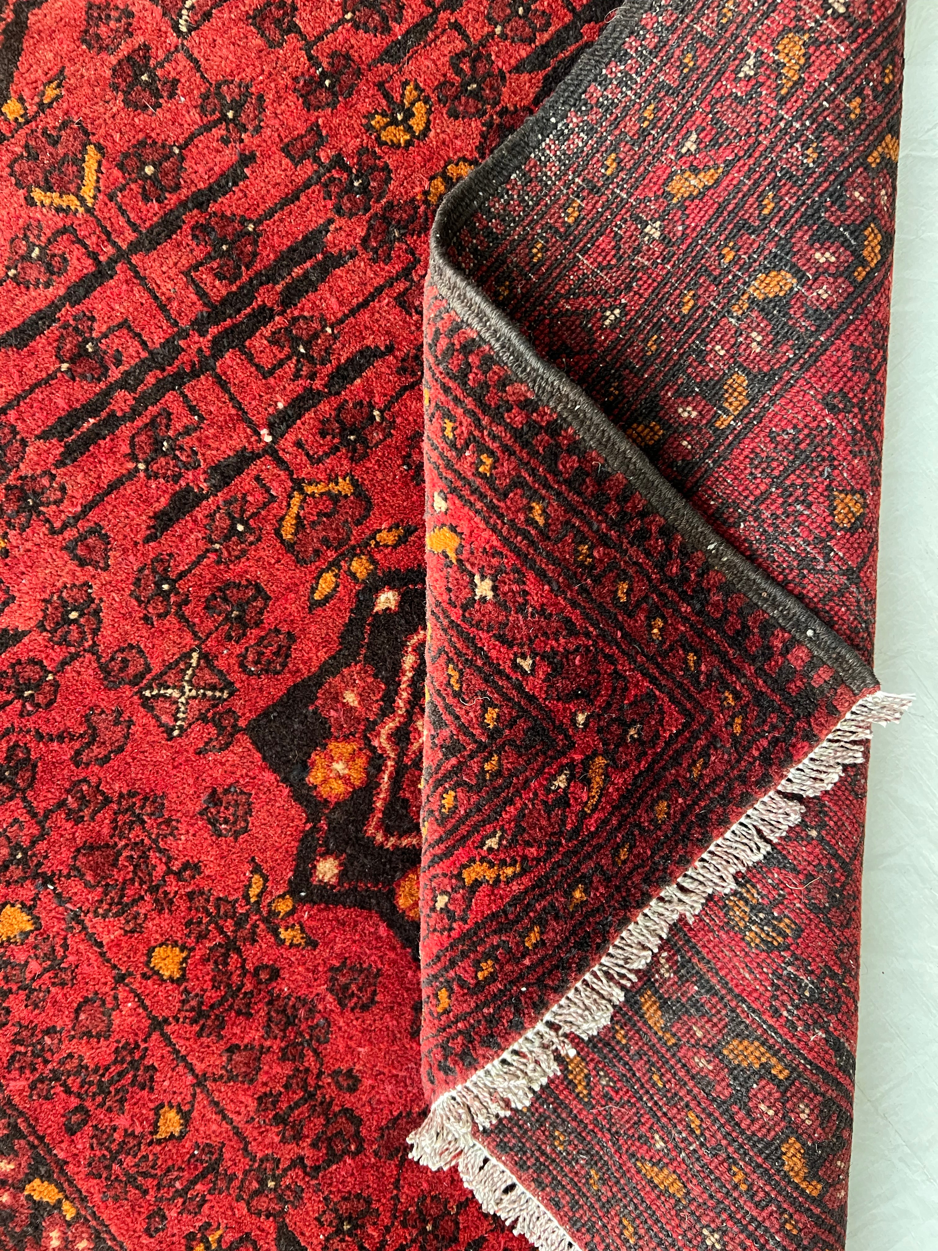 Afghani Rug 4x10 size range bukhara Red laid flat