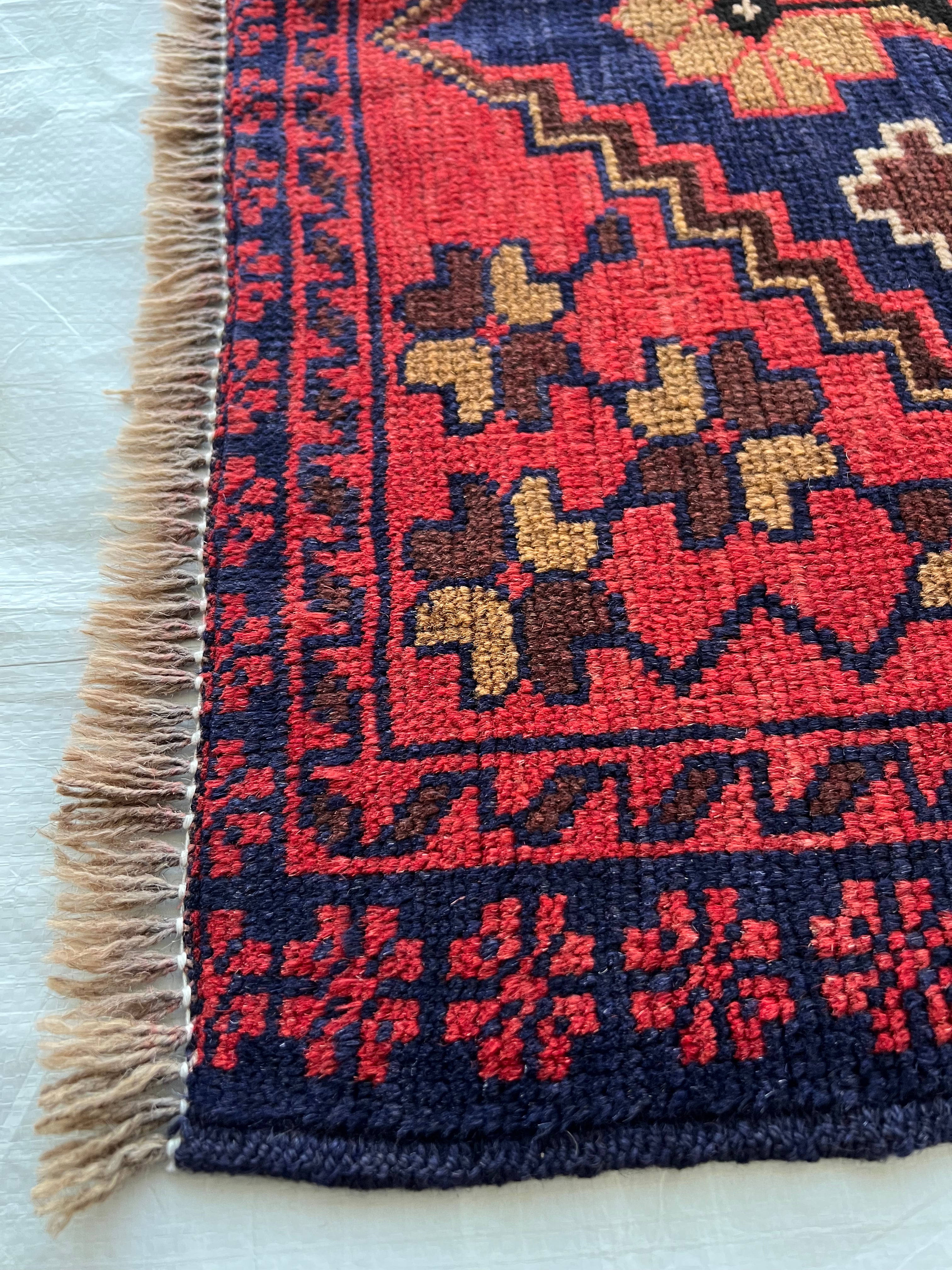 Afghani Runner runner size range tribal Red Blue laid flat