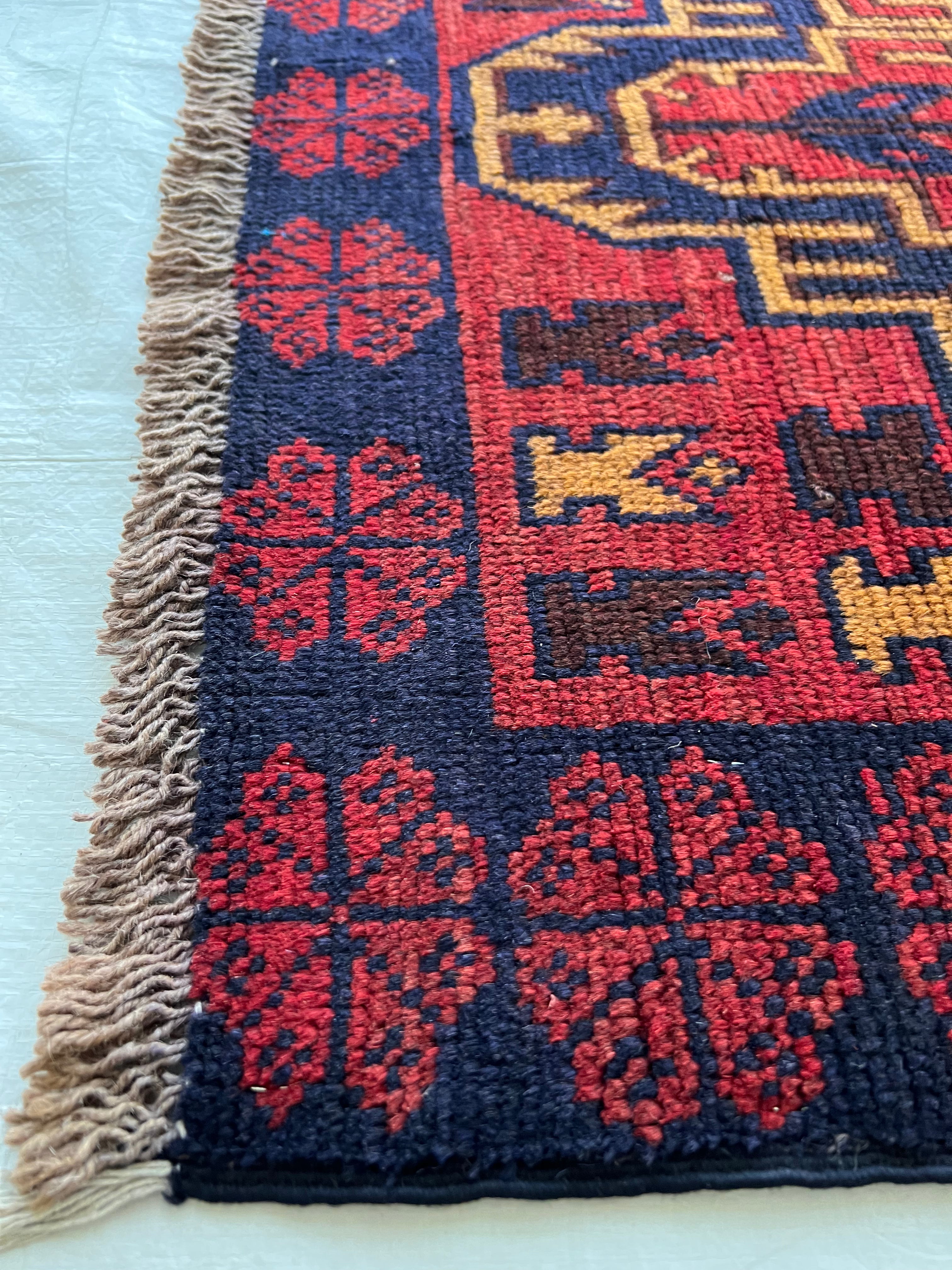 Afghani Runner runner size range tribal Red laid flat