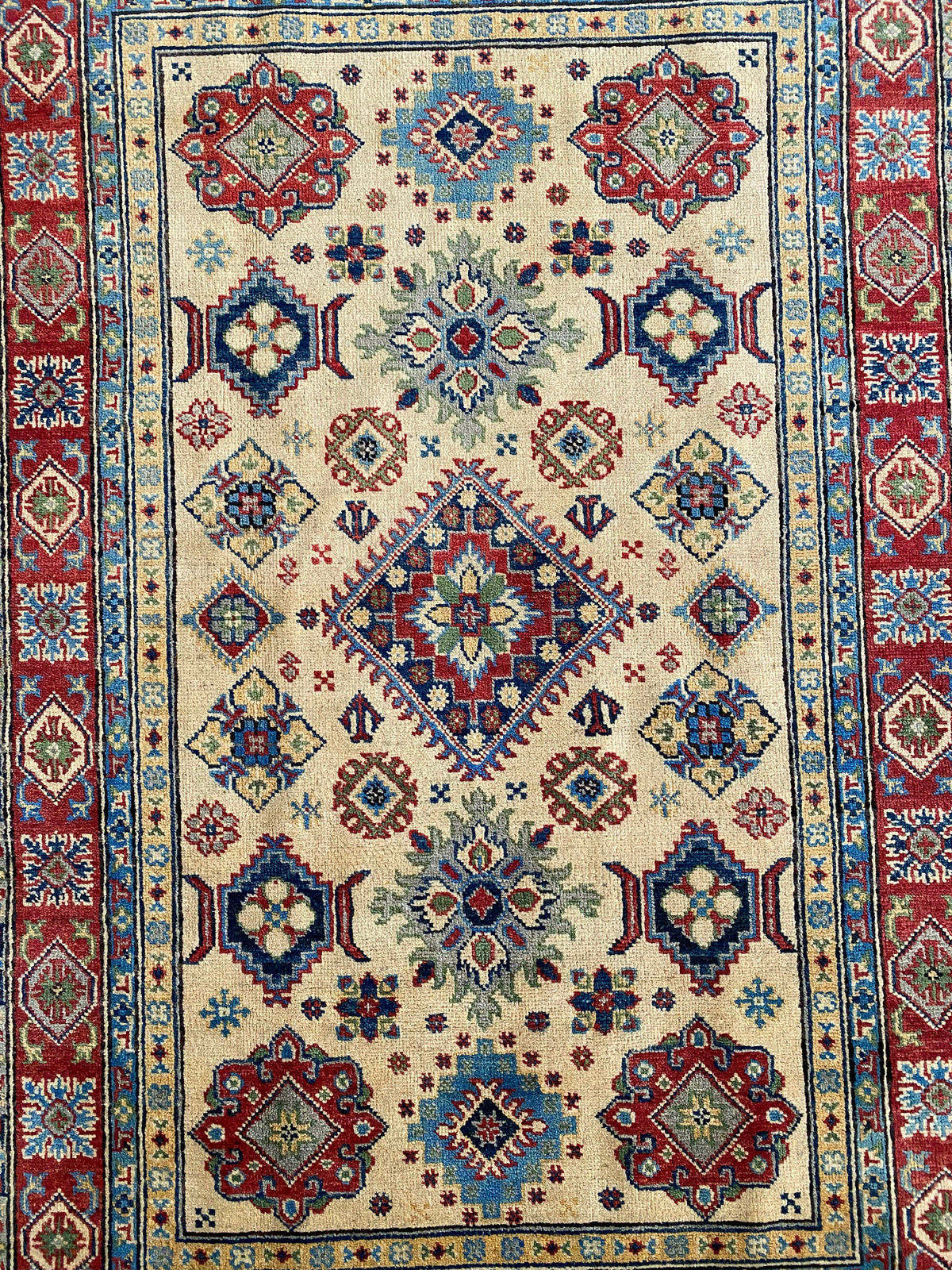Kazak Rug 4x6 | Ivory, Red & Navy | hand-knotted wool | close-up of pile and border