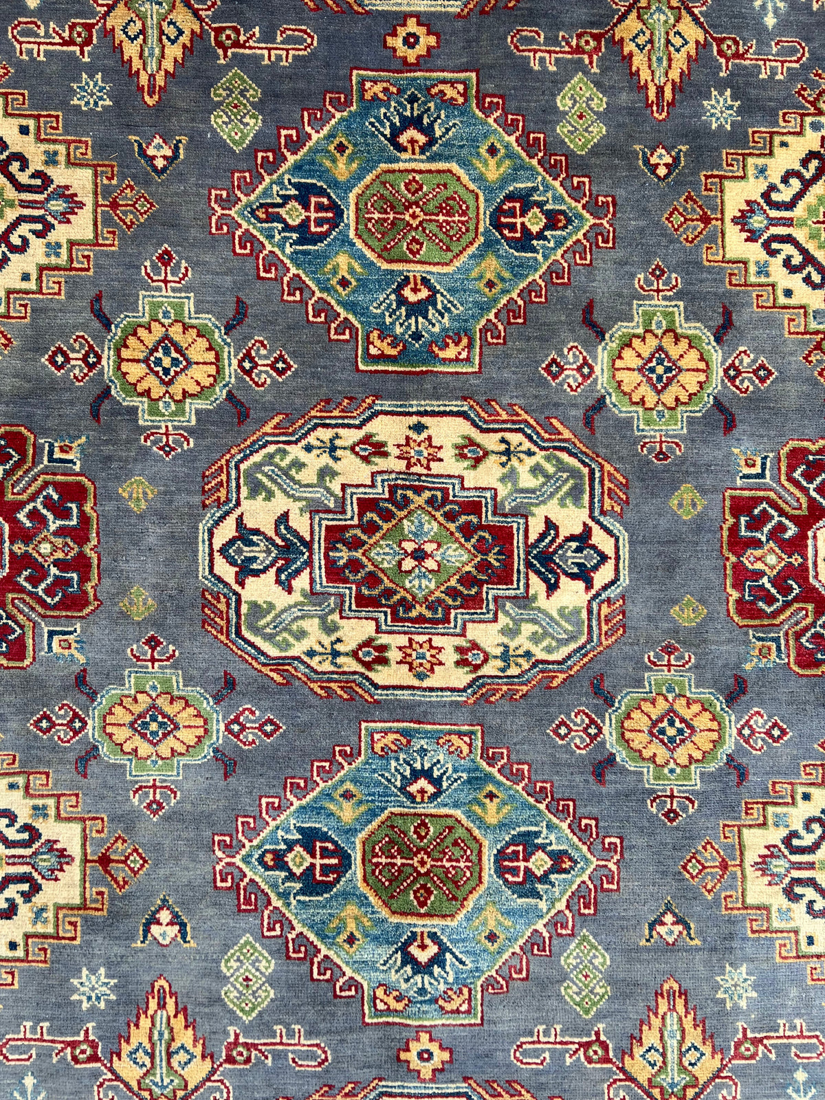 Kazak Rug 8x10 | Gray, Ivory & Red | hand-knotted wool | close-up of pile and border