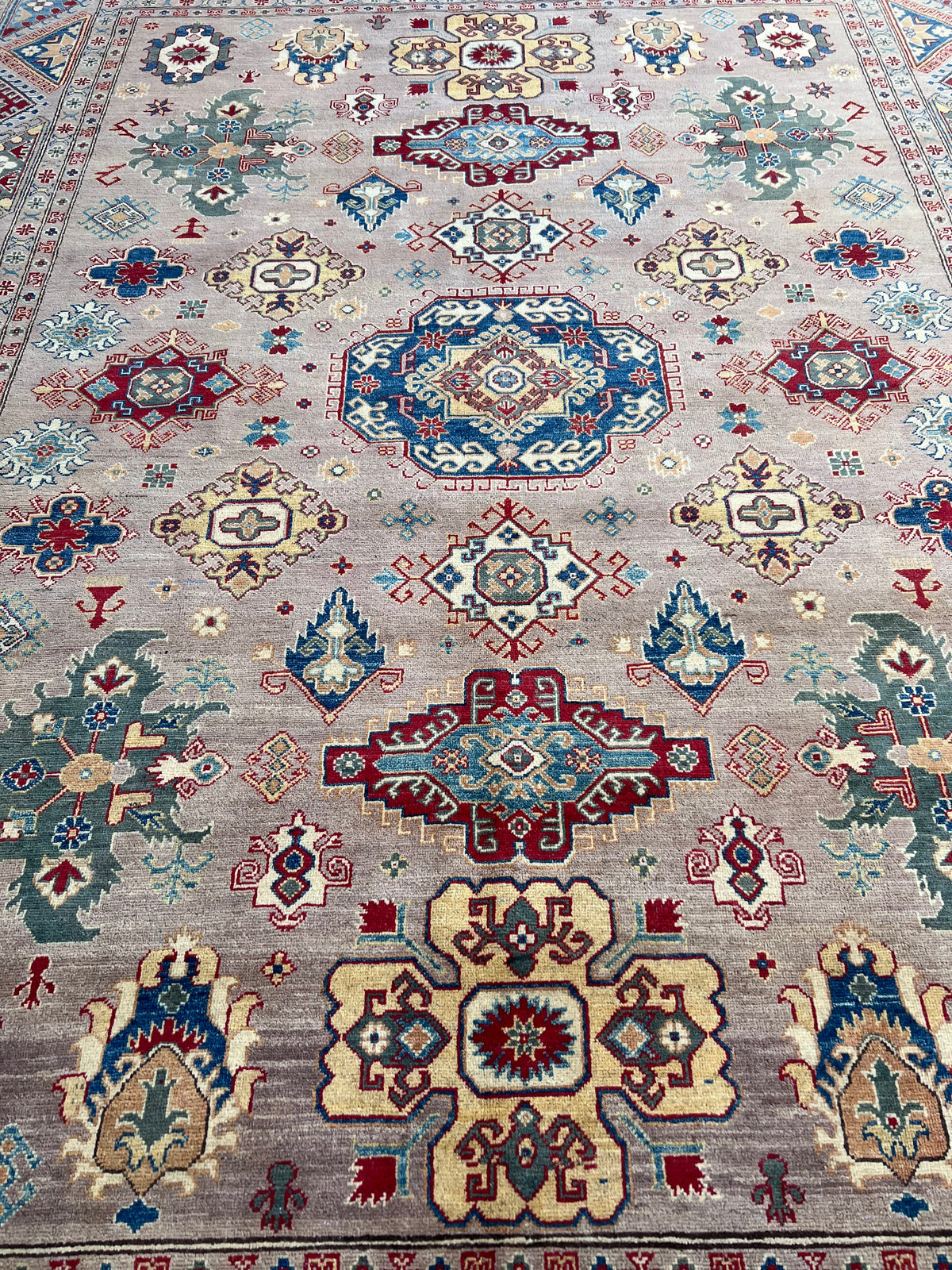 Kazak Rug 9x12 | Taupe, Navy & Red | hand-knotted wool | close-up of pile and border
