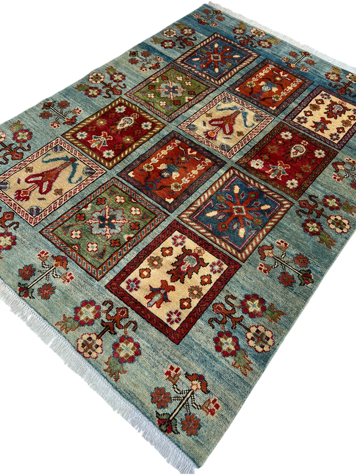 Kazak Rug 5x6 | Light Blue, Red & Gold | hand-knotted wool | angled view