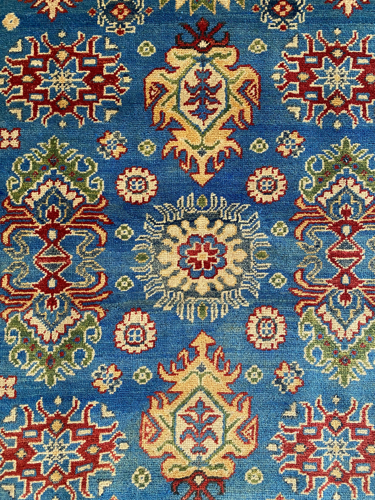Kazak Rug 4x6 | Blue, Red & Ivory | hand-knotted wool | close-up of pile and border