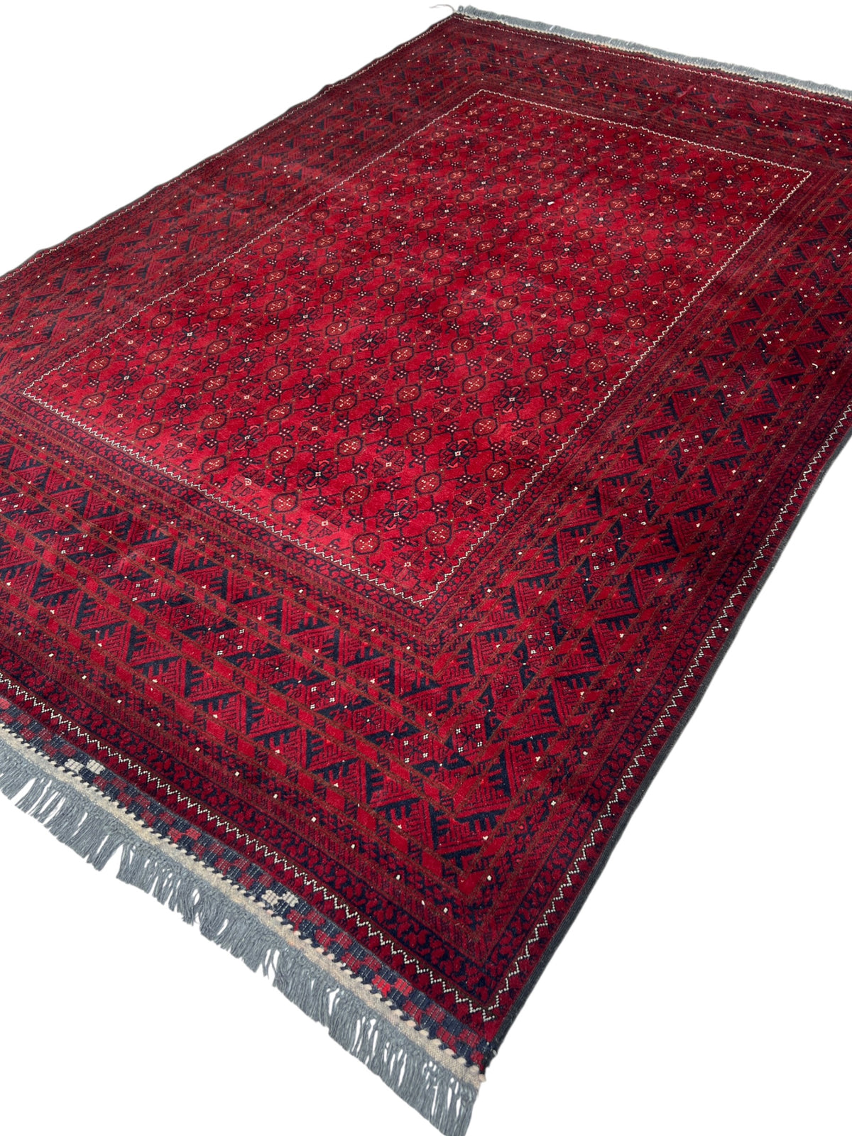Bashiri Rug 6x9 | Red, Burgundy & Navy | hand-knotted wool | angled view