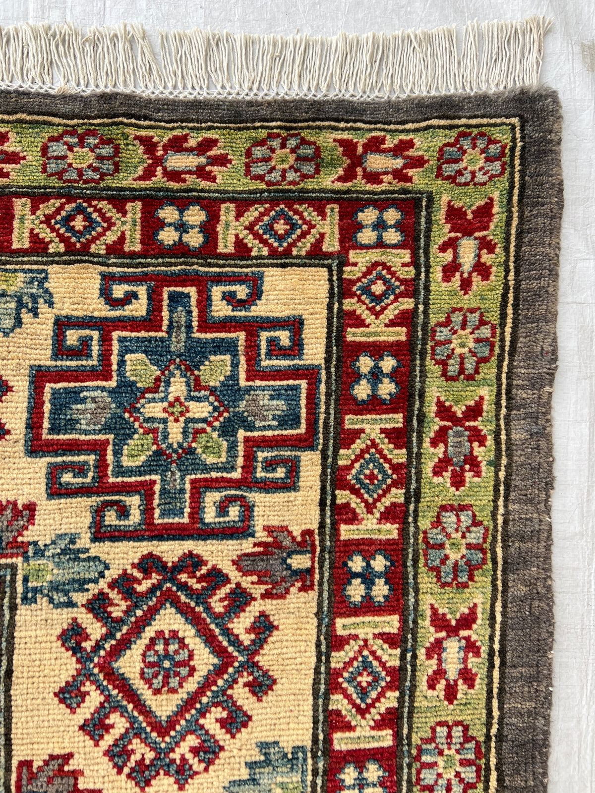 Kazak Rug 8x8 | Charcoal, Red & Ivory | hand-knotted wool | close-up of pile and border