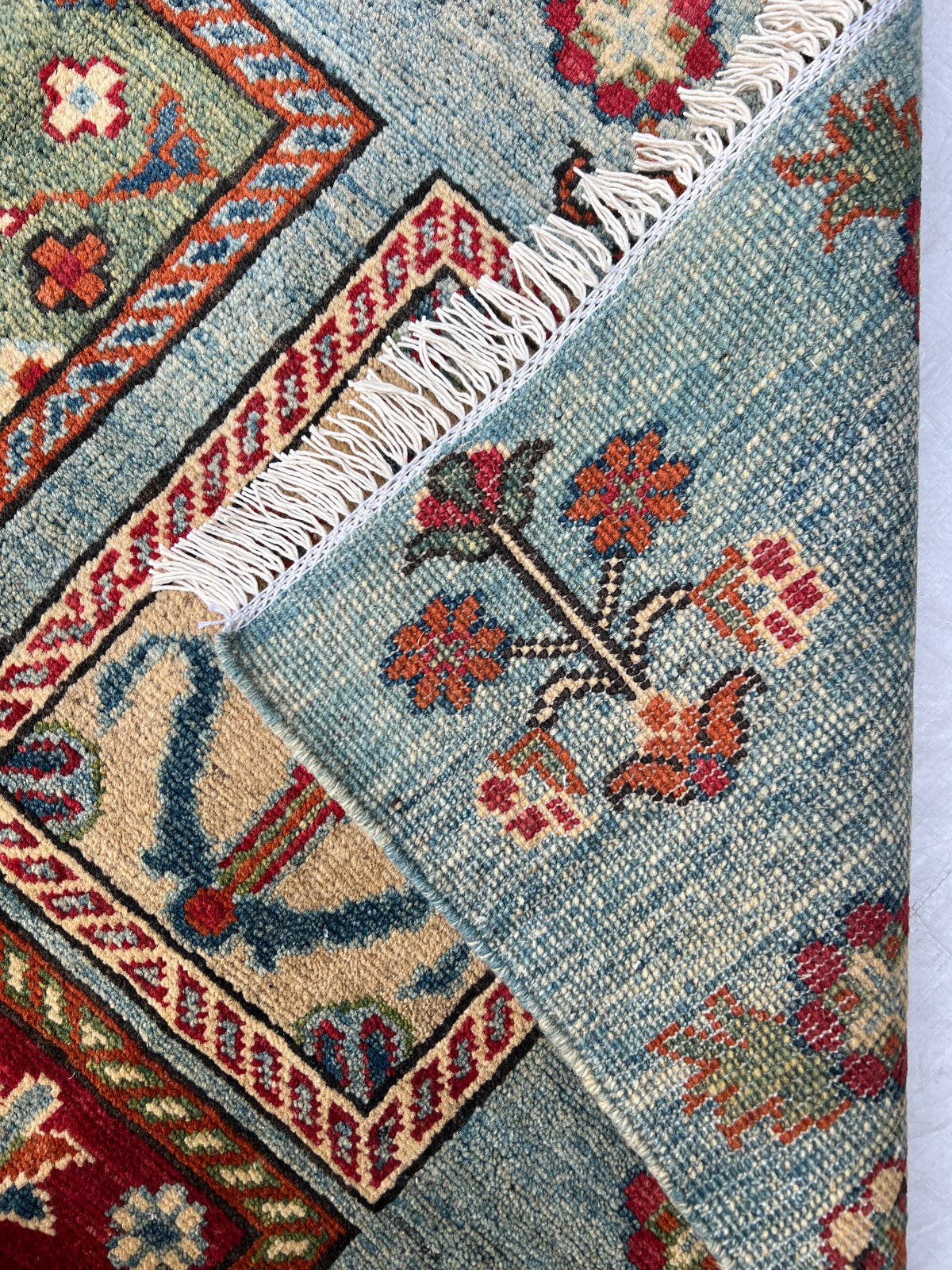Kazak Rug 5x6 | Light Blue, Red & Gold | hand-knotted wool | back of rug, knot detail