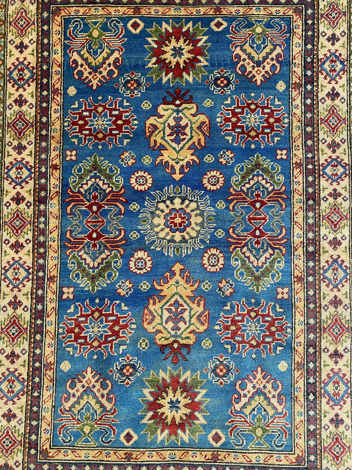 Kazak Rug 4x6 | Blue, Red & Ivory | hand-knotted wool | close-up of pile and border
