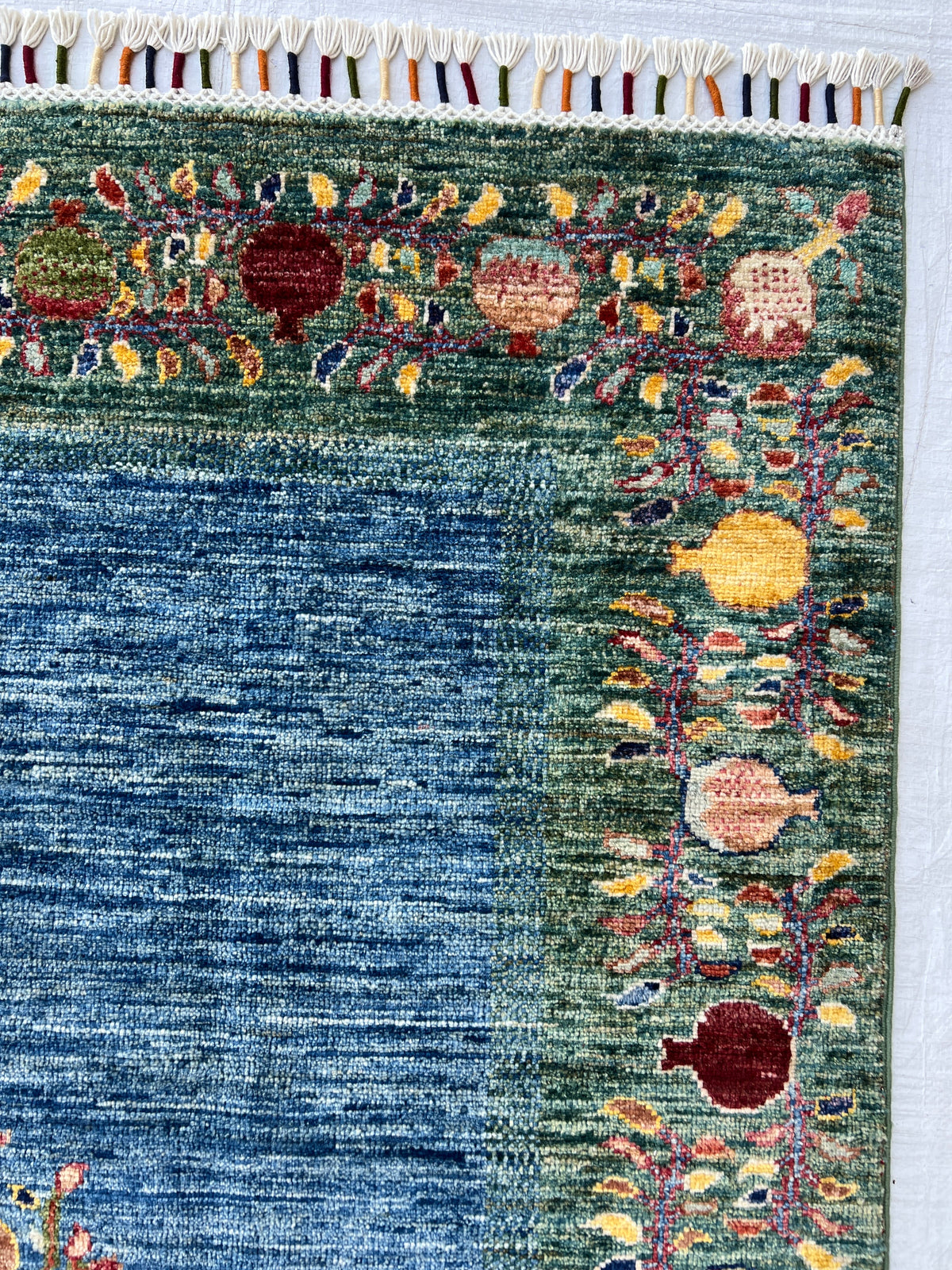 Chobi Rug 5x7 | hand-knotted wool | close-up of pile and border