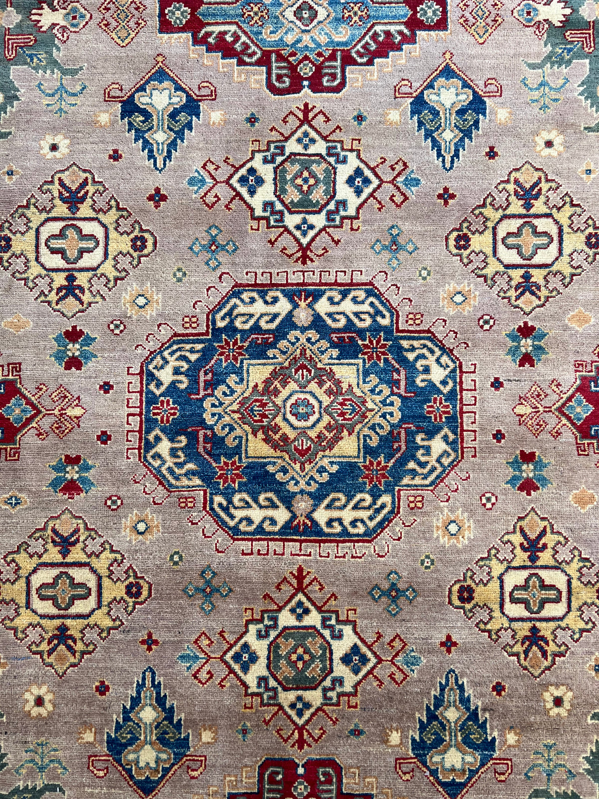 Kazak Rug 9x12 | Taupe, Navy & Red | hand-knotted wool | close-up of pile and border