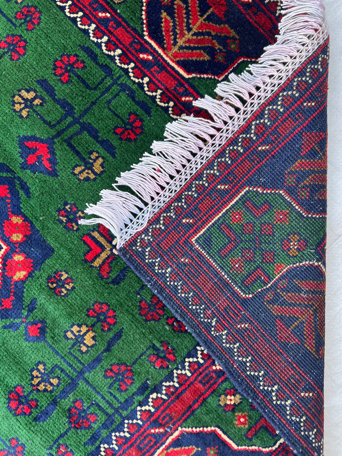 Bukhara Rug 3x5 | Green, Navy & Red | hand-knotted wool | back of rug, knot detail