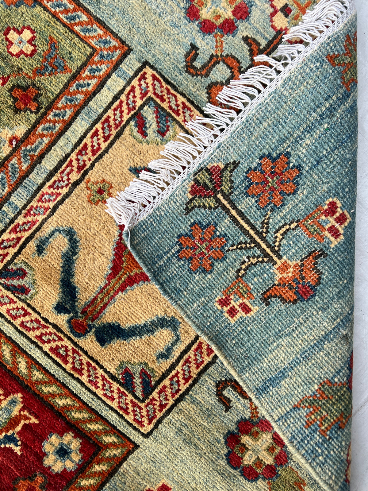 Kazak Rug 5x6 | Light Blue, Red & Gold | hand-knotted wool | back of rug, knot detail
