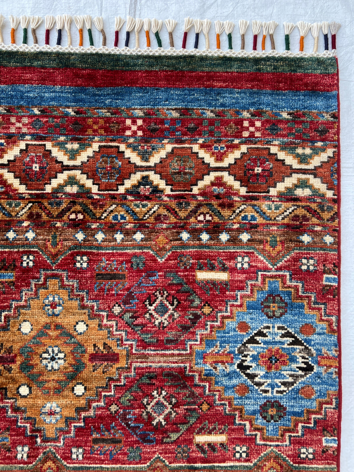 Chobi Rug 7x10 | hand-knotted wool | close-up of pile and border