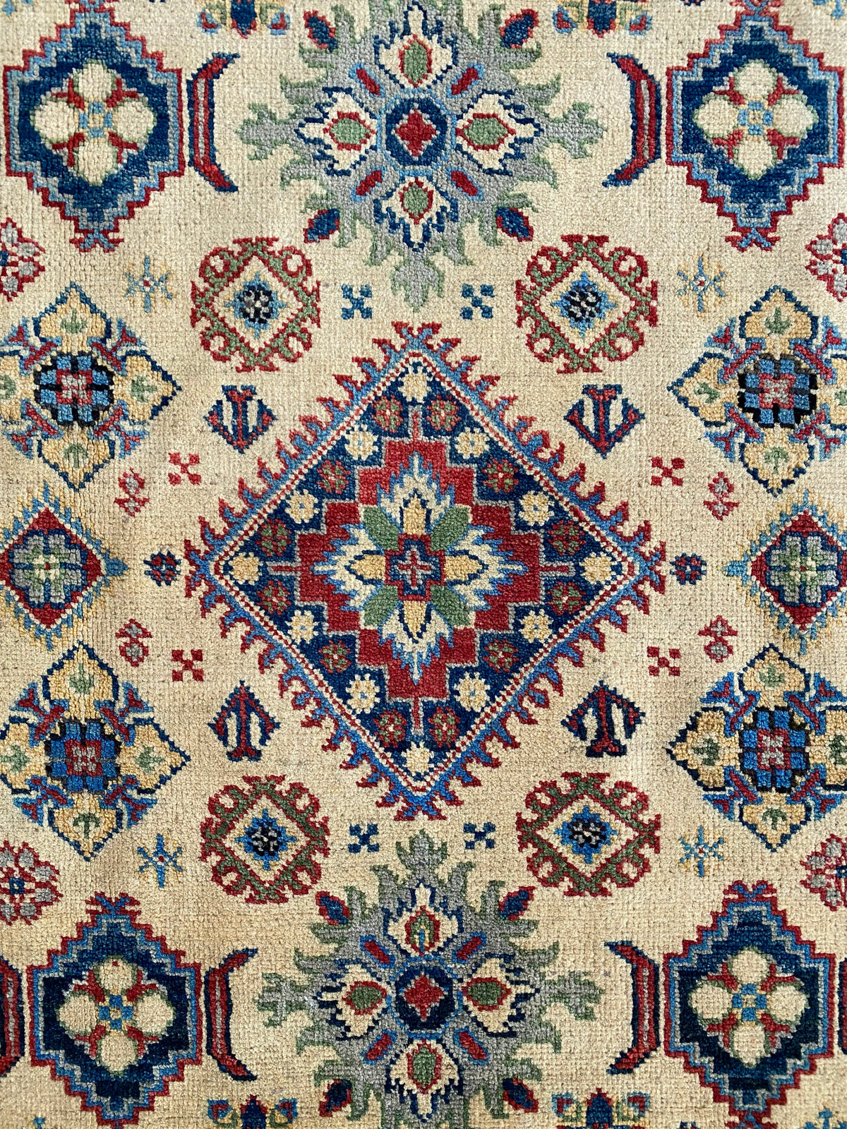 Kazak Rug 4x6 | Ivory, Red & Navy | hand-knotted wool | close-up of pile and border