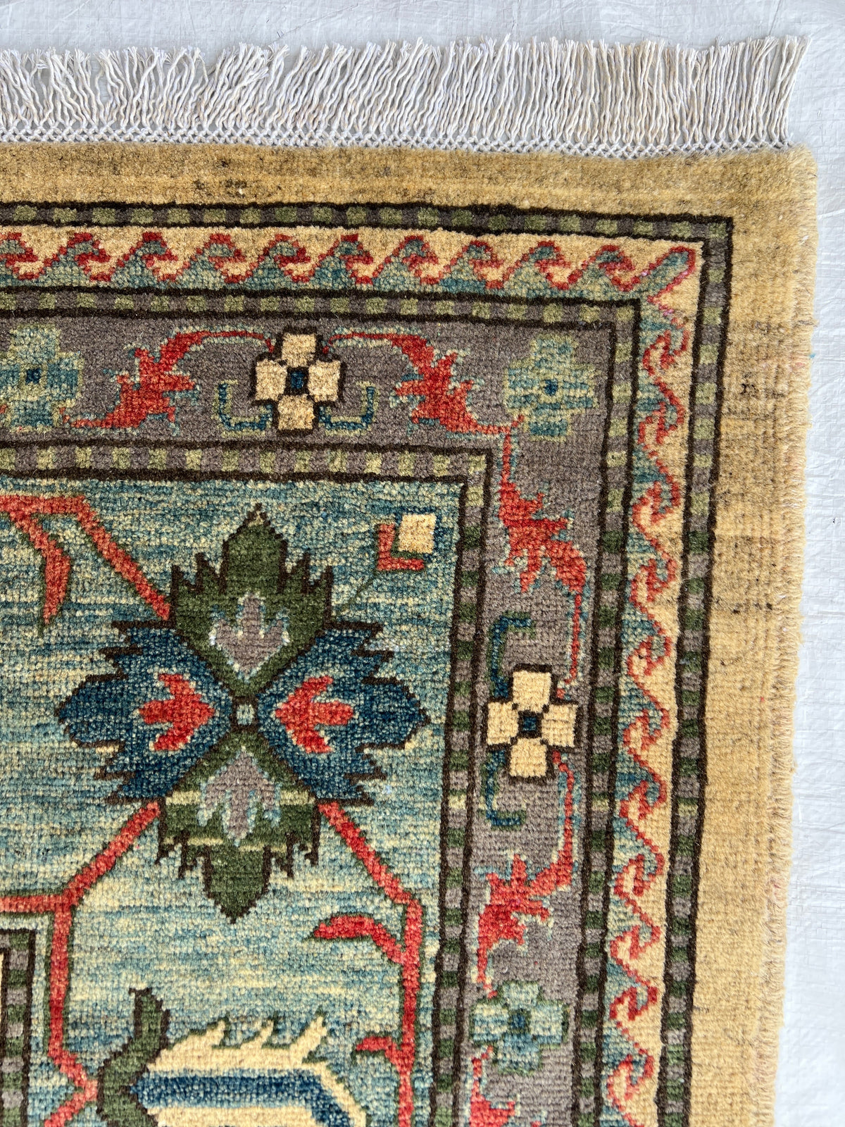 Kazak Rug 10x13 | Ivory, Red & Navy | hand-knotted wool | close-up of pile and border