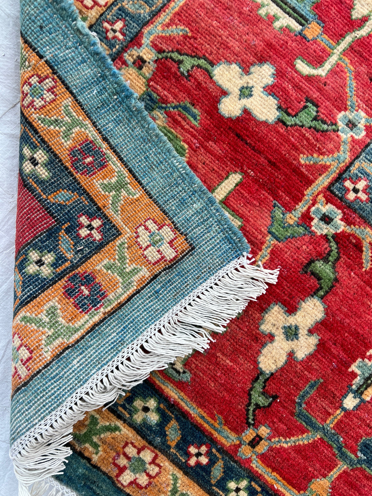Kazak Rug 9x14 | Teal, Ivory & Red | hand-knotted wool | back of rug, knot detail