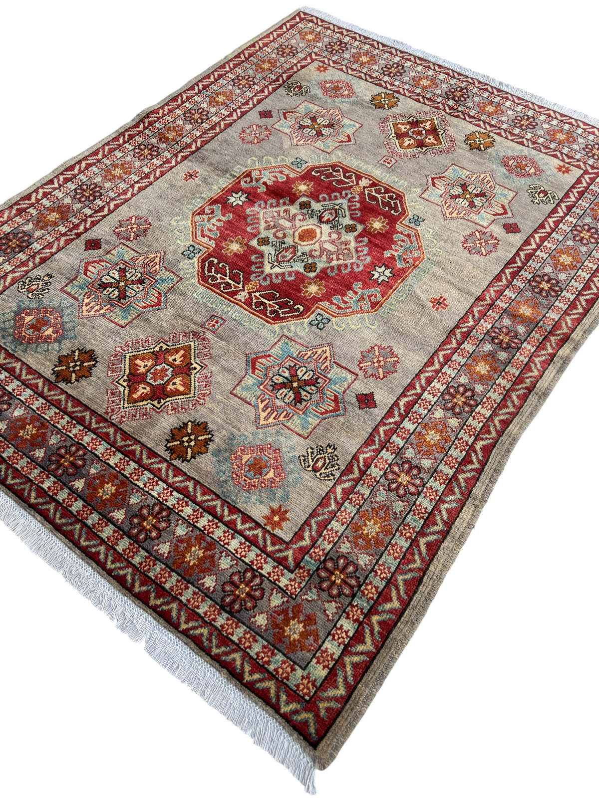 Kazak Rug 5x7 | Gray, Red & Ivory | hand-knotted wool | angled view