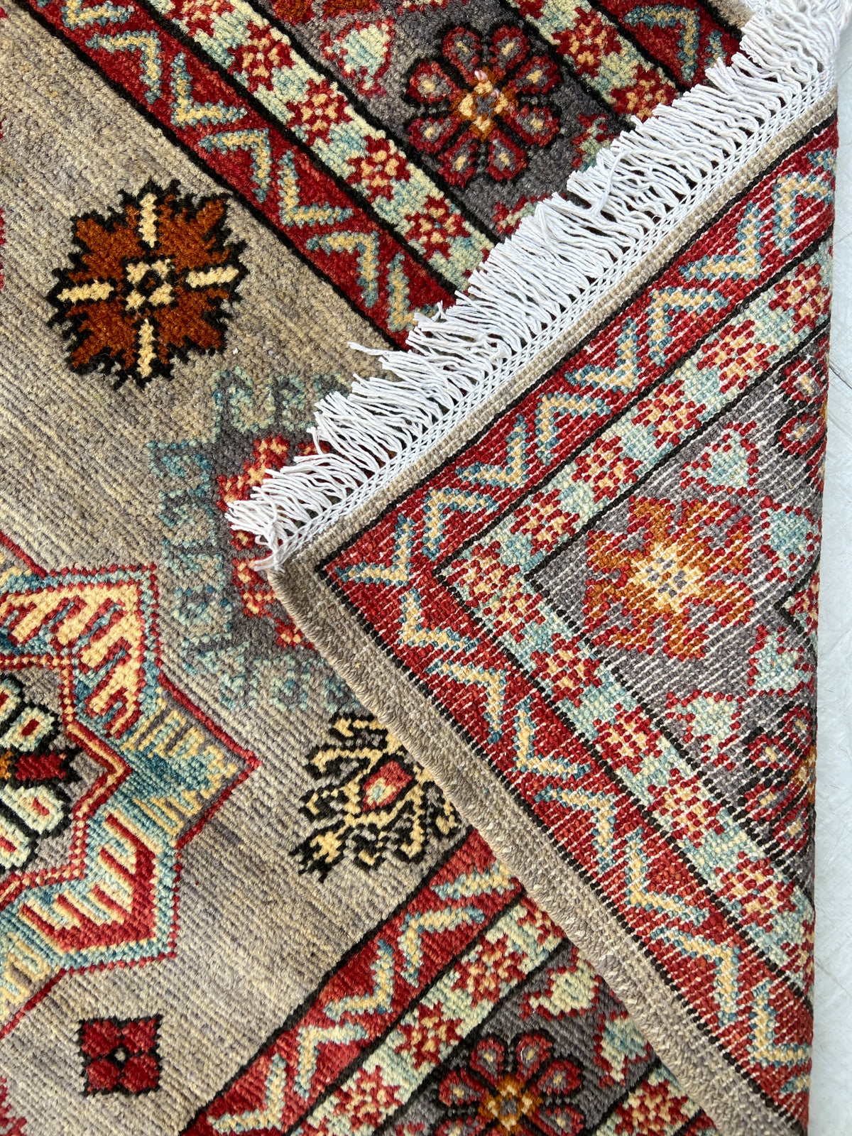 Kazak Rug 5x7 | Gray, Red & Ivory | hand-knotted wool | back of rug, knot detail