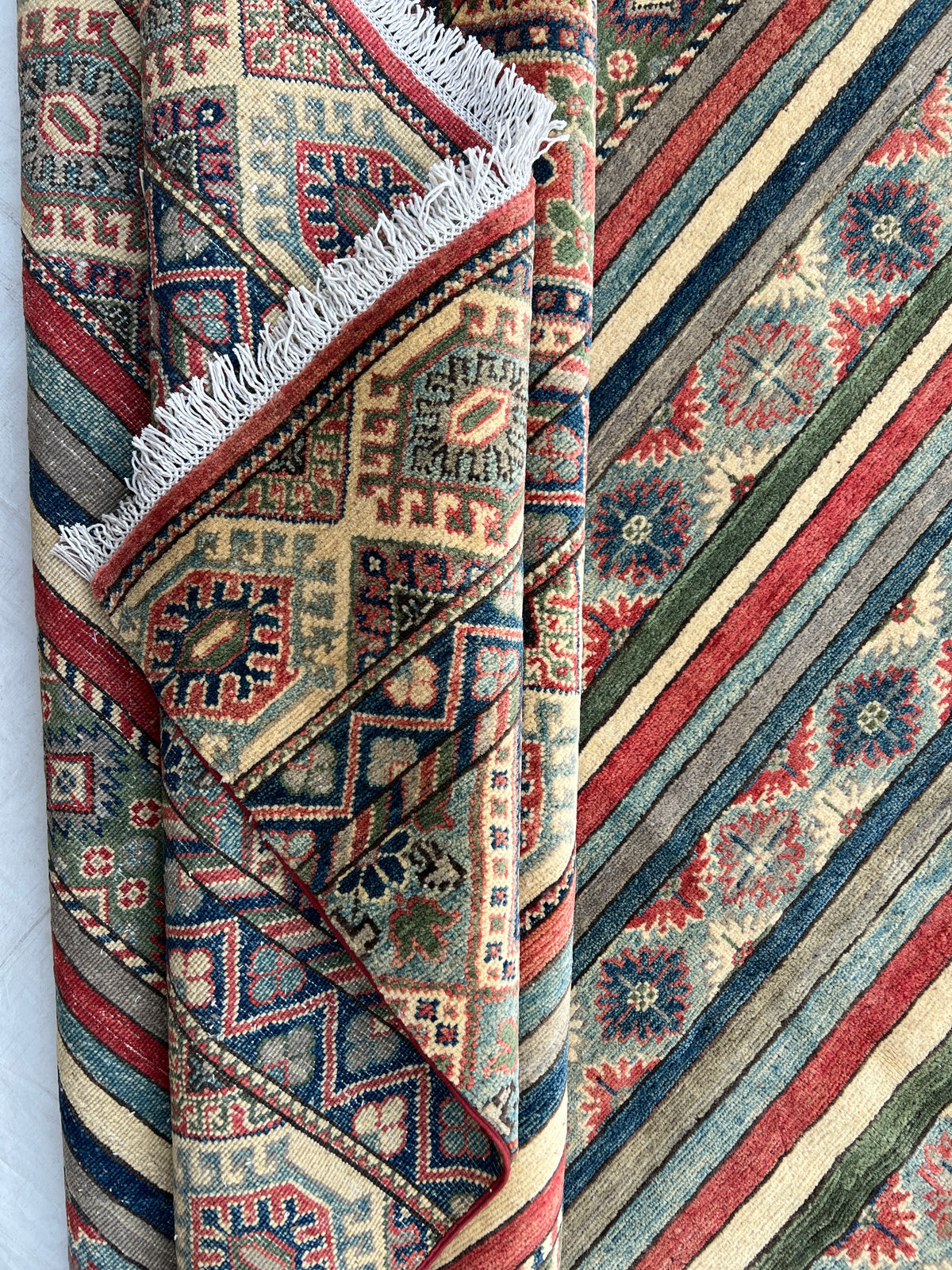 Kazak Rug 9x12 | Ivory, Red & Navy | hand-knotted wool | back of rug, knot detail