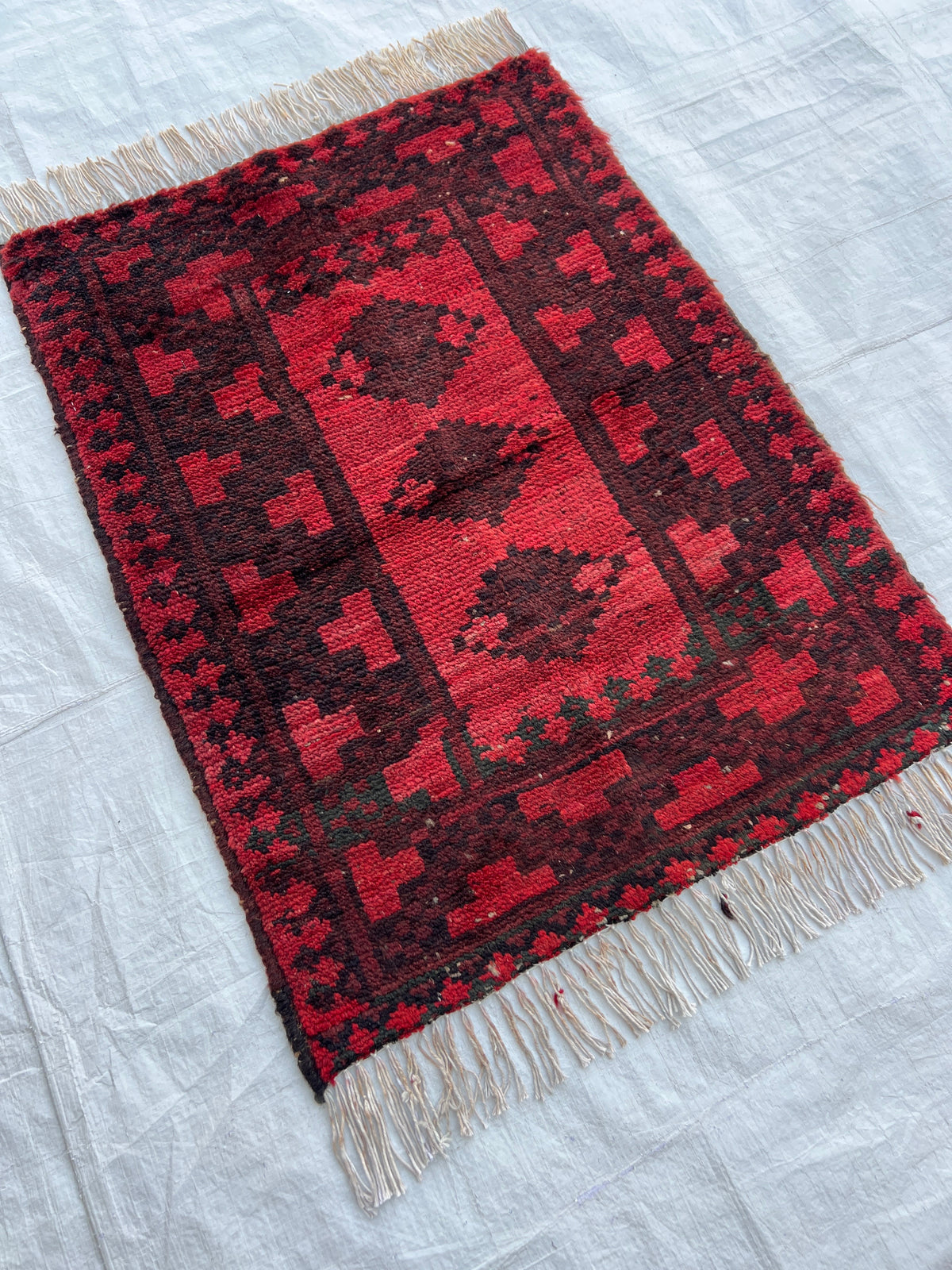 Baluch Rug 2x2 | Red, Brick & Charcoal | hand-knotted wool | angled view