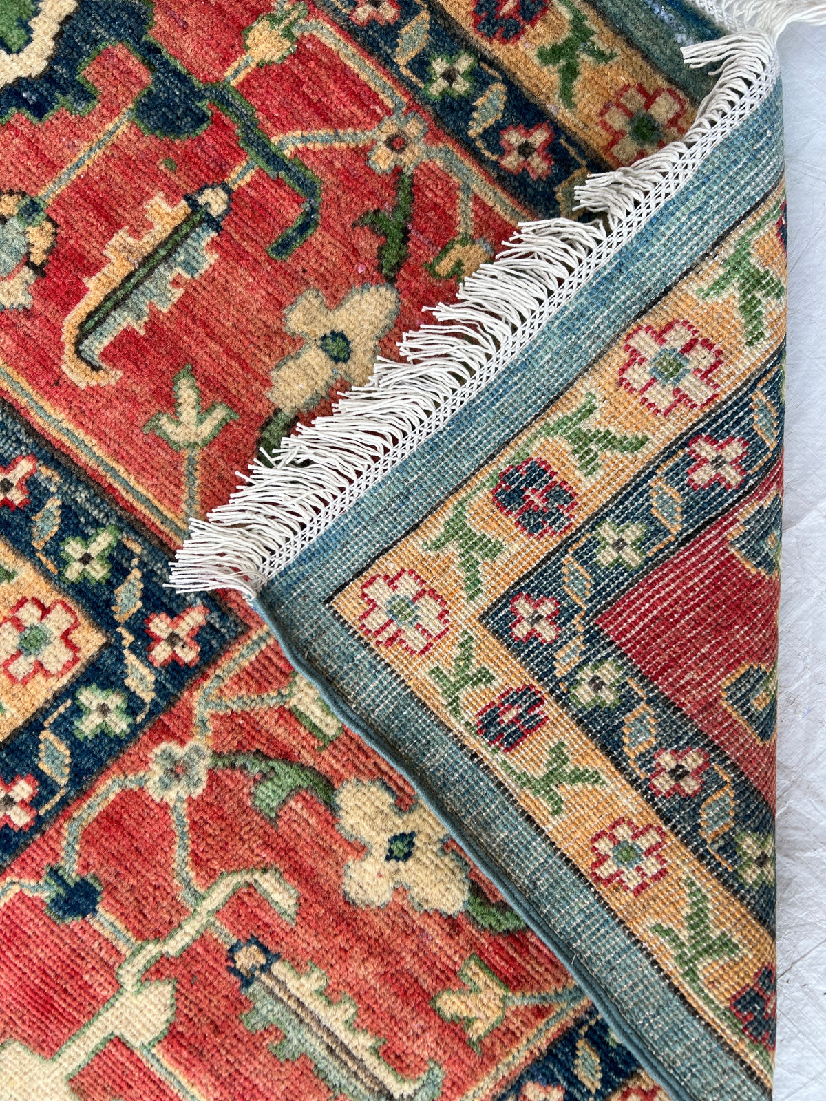 Kazak Rug 9x14 | Teal, Ivory & Red | hand-knotted wool | back of rug, knot detail