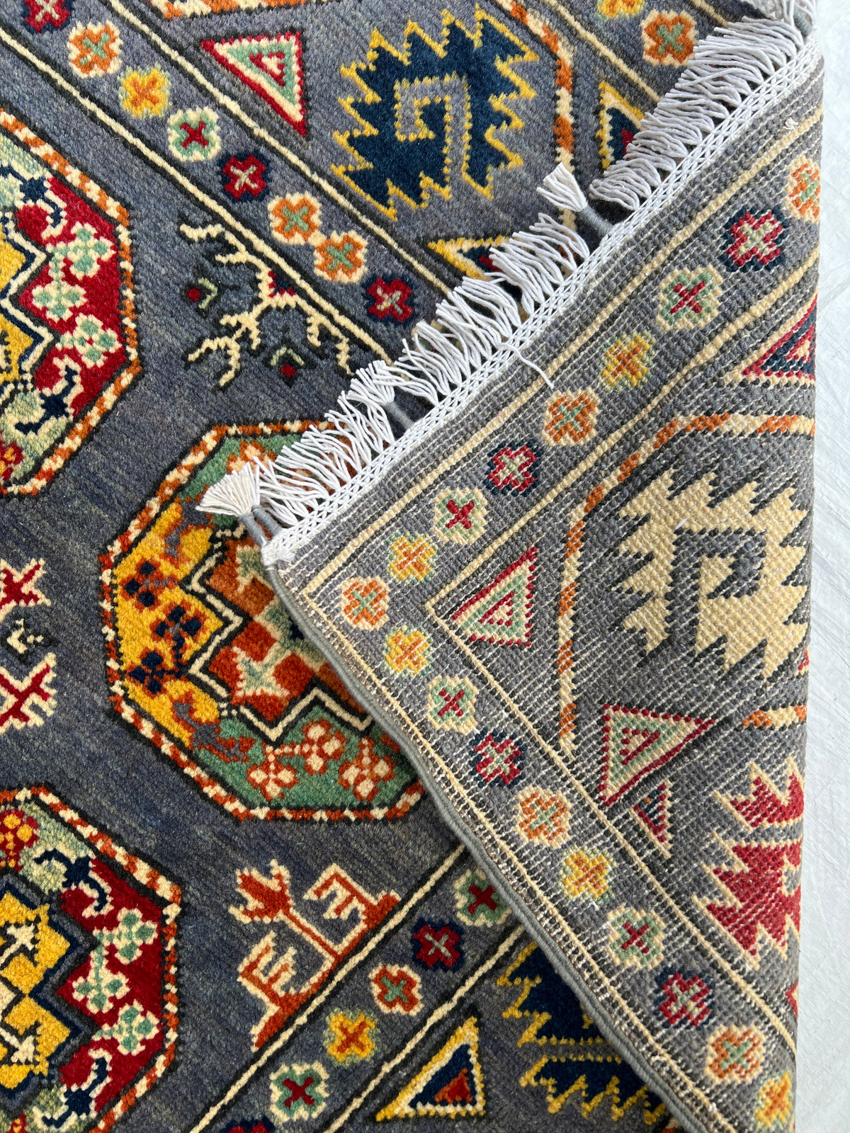 Kazak Rug 3x5 | Charcoal, Red & Gold | hand-knotted wool | back of rug, knot detail