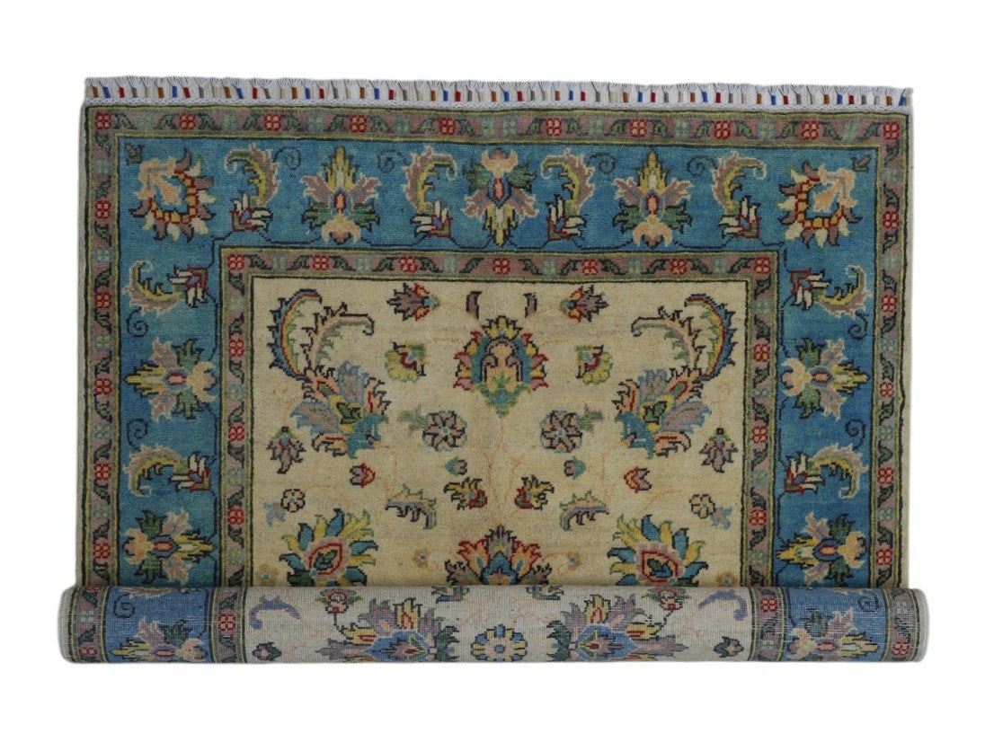 Afghani Rug 5x8 size range tribal Blue Cream laid flat