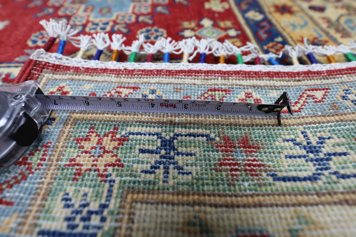 Afghani Rug 7x10 size range tribal Red Cream laid flat