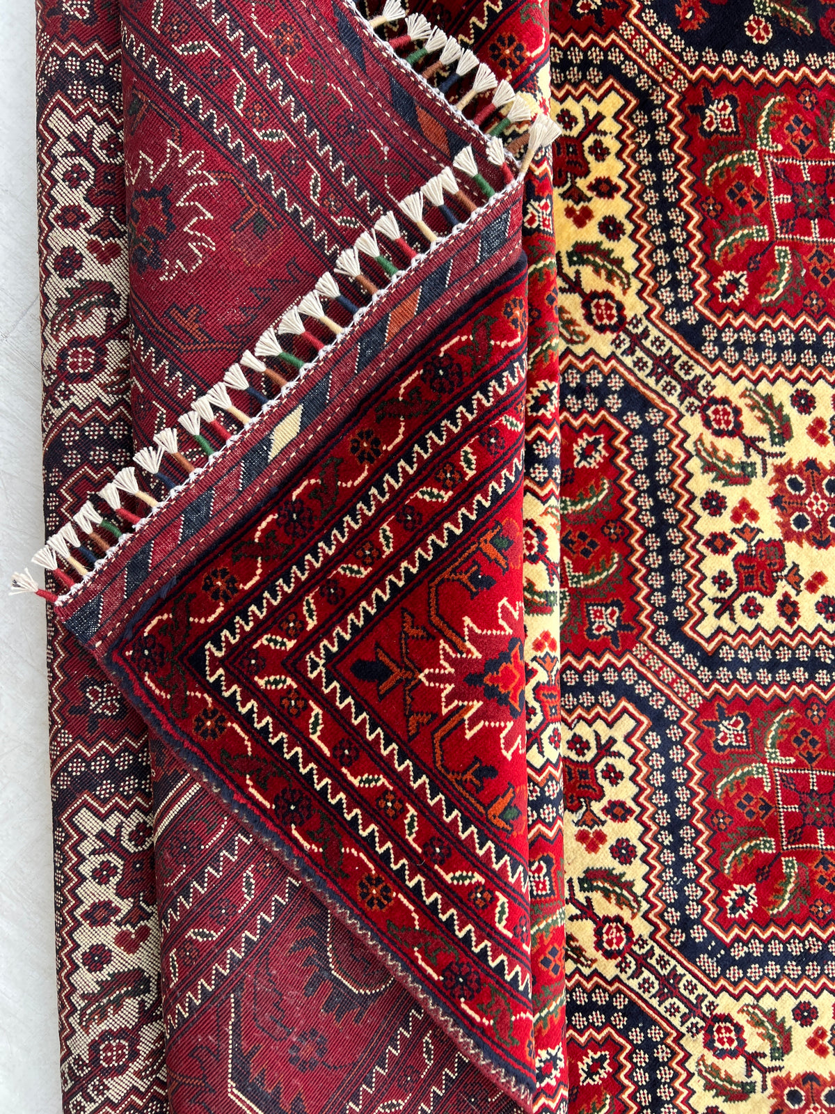 Kashi Rug 7x10 | Red, Ivory & Black | hand-knotted wool | back of rug, knot detail