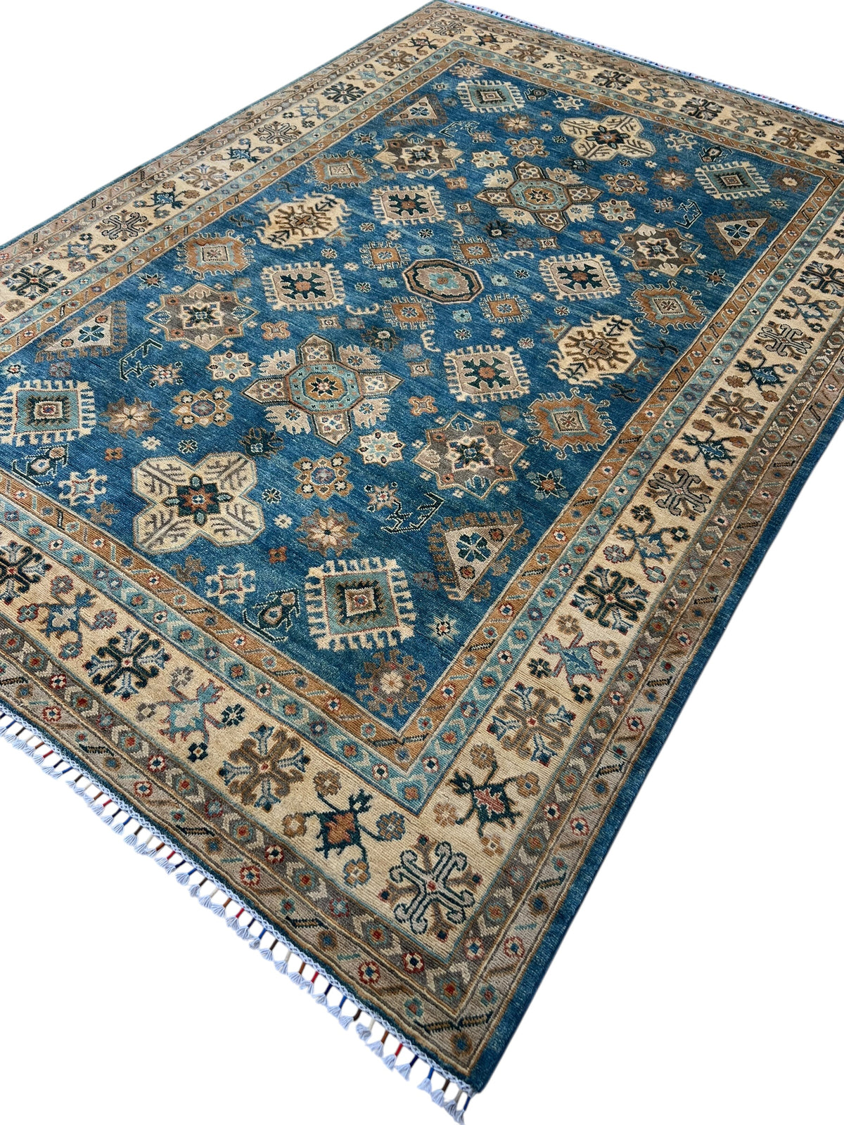 Kazak Rug 7x9 | Blue, Ivory & Gold | hand-knotted wool | angled view